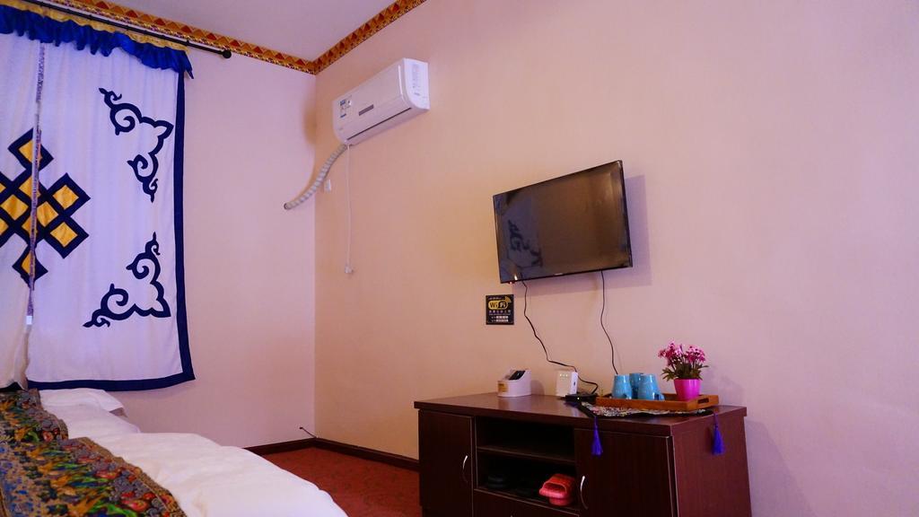 Wo Home Hostel Jiuzhaigou Rom bilde